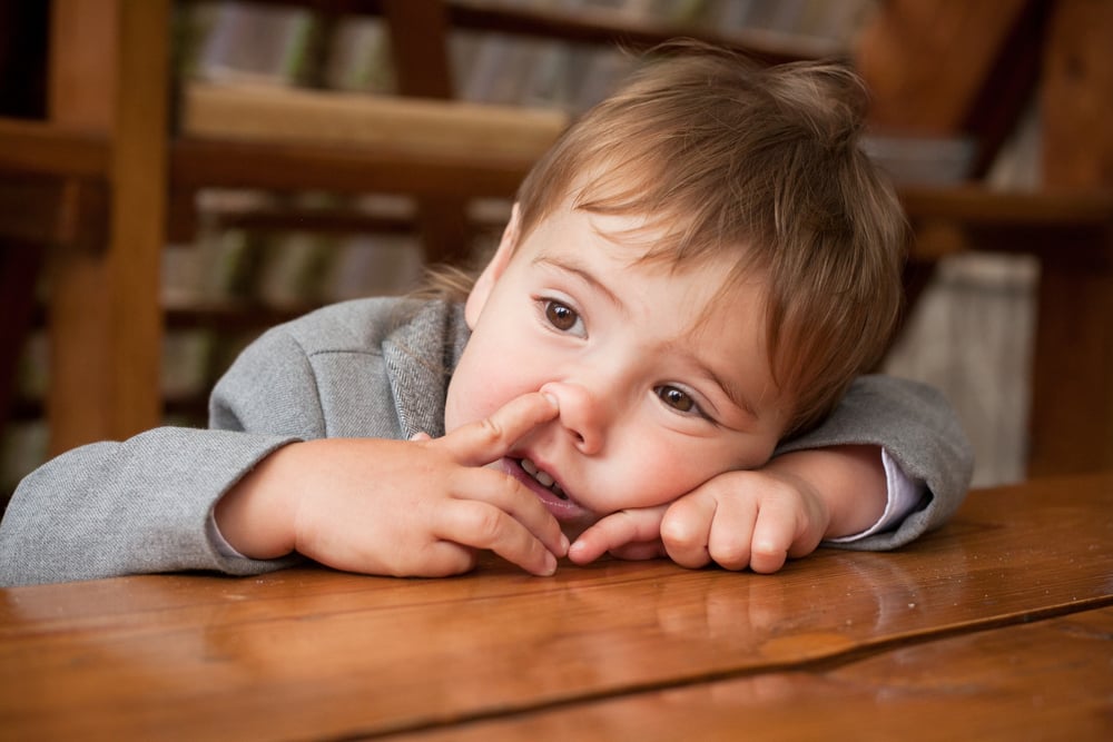 Little,Baby,Boy,With,Finger,In,His,Nose