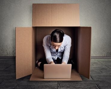 Closeup,Young,Introvert,Businesswoman,Hiding,Sitting,In,The,Carton,Box