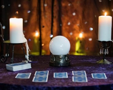 Fortune Telling Table with a crystal ball and tarot cards
