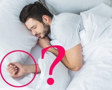 top view of bearded man sleeping on bed in bedroom