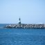 Landscape,With,A,Green,Lighthouse,On,A,Breakwater,On,The