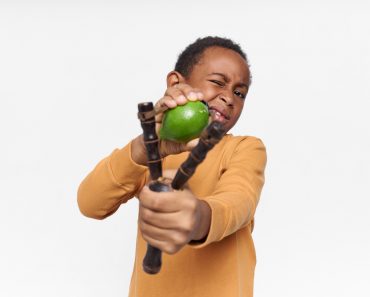 Isolated,Image,Of,Playful,Active,African,Little,Boy,Posing,Against