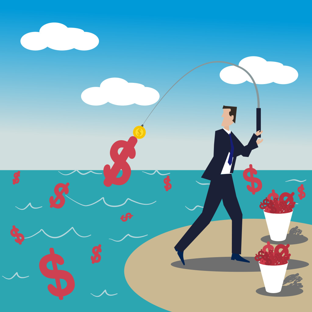 A business man standing fishing money with gold coin