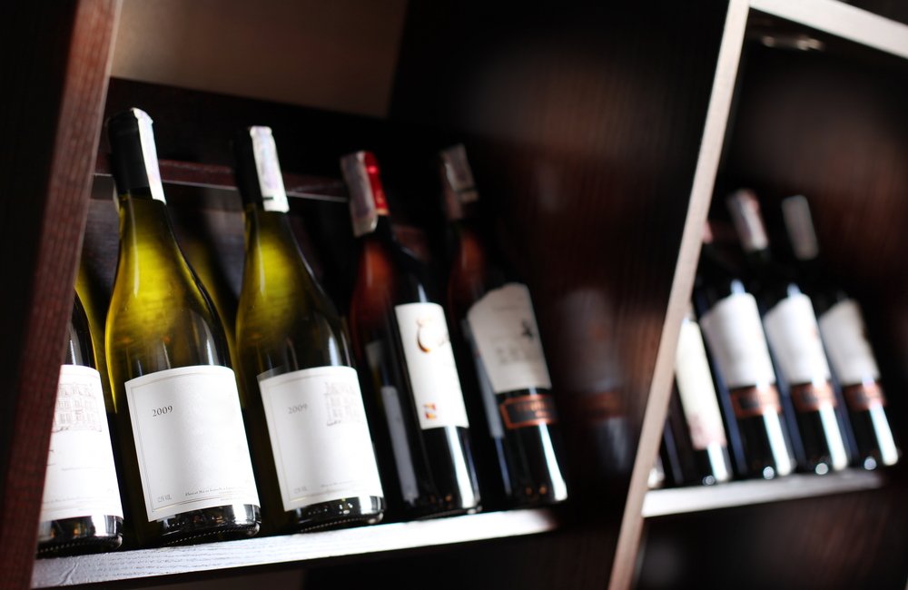 Wine Bottles on Wooden Shelf