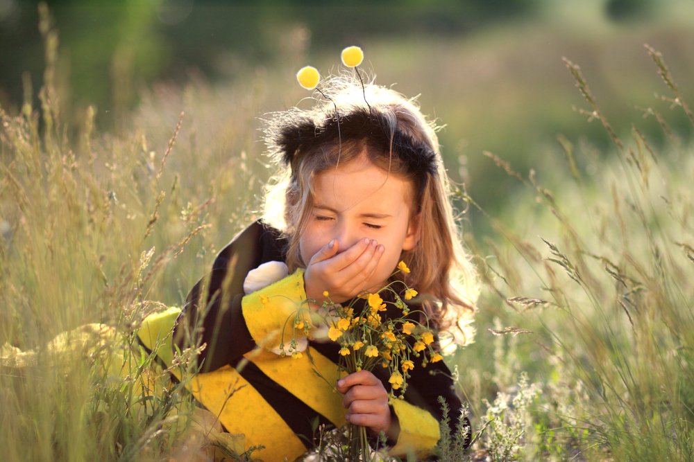 girl sneezing