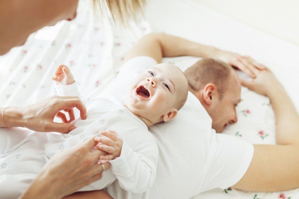 Mother Tickling Her Baby (Photo Credit: razyph / Fotolia)