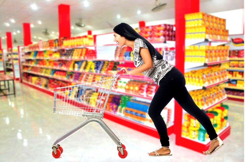 Woman pushing shopping cart trolly