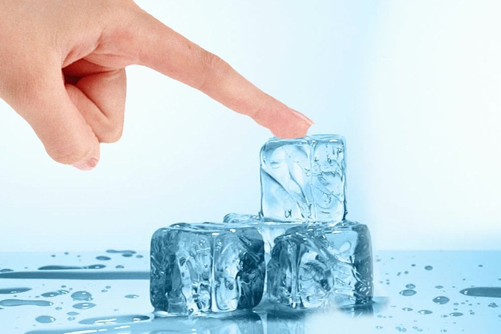 ice cube melting in hand