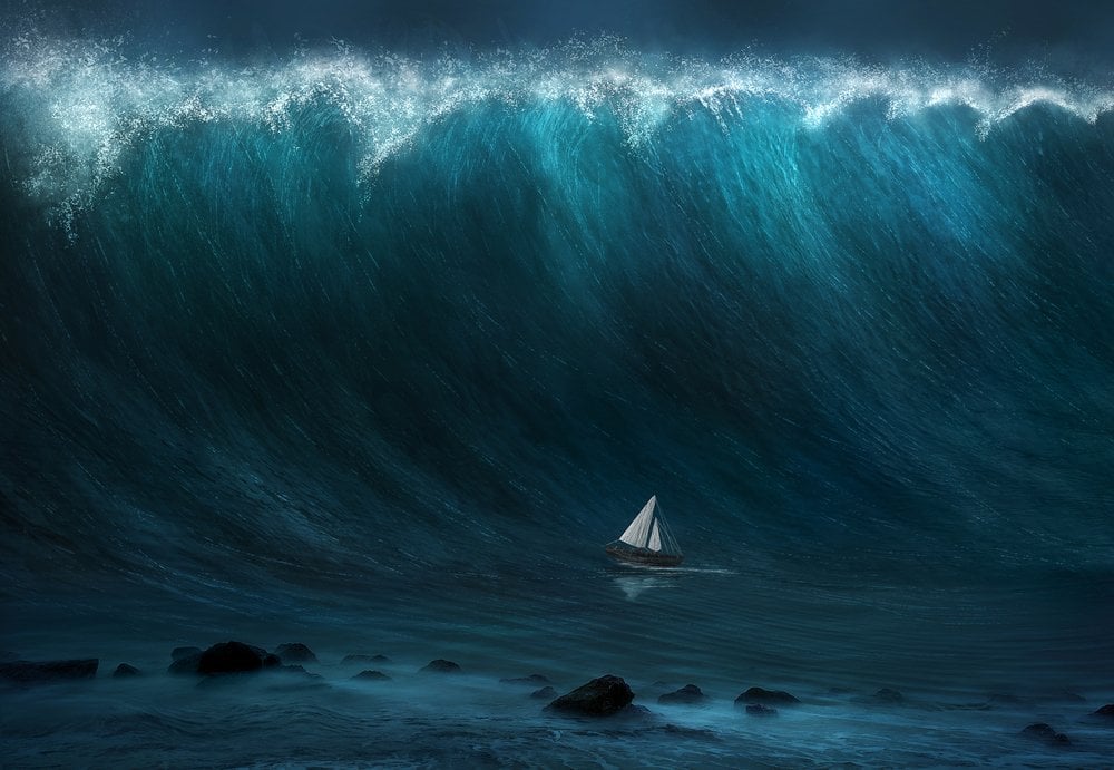 A small boat being captured by a large tsunami wave