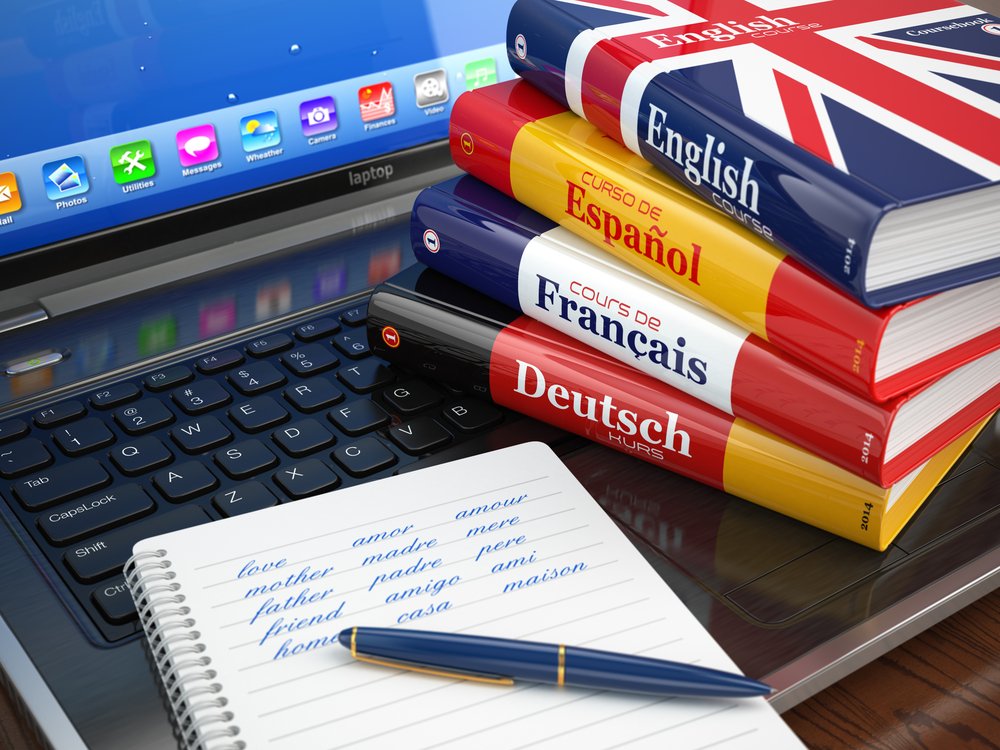 E-learning. Learning languages online. Dictionaries on laptop. 3d