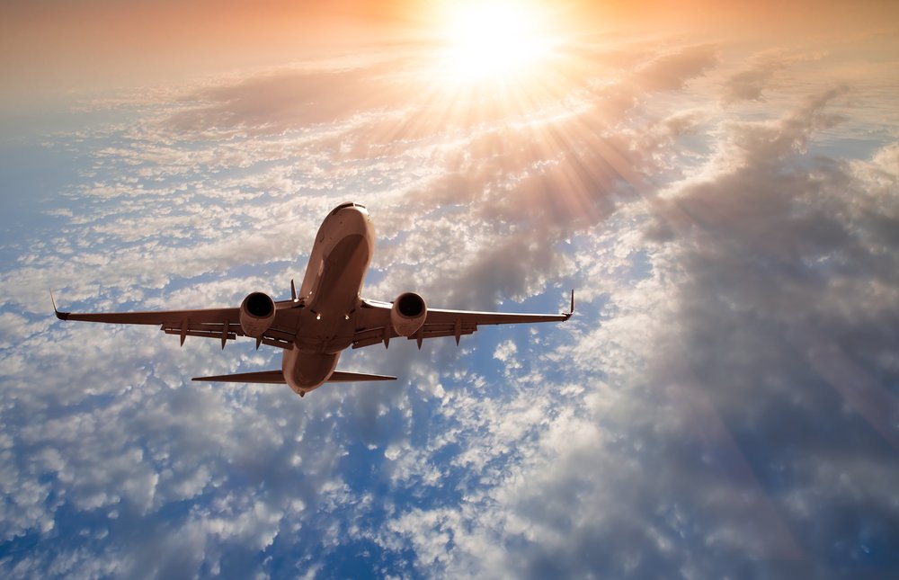 passenger airplane in the clouds