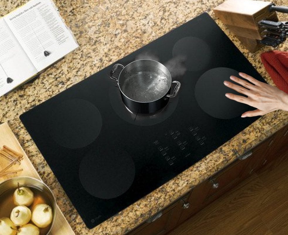 Hand on Induction Cooktop