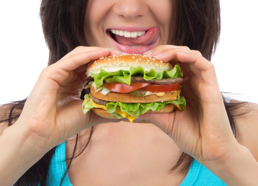 Tasty unhealthy burger sandwich in hands
