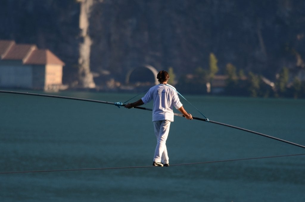 Why Do Tightrope Walkers Carry A Pole/Bar During Their Performance? »  Science ABC