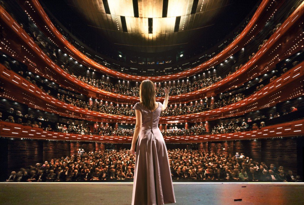 Lady opera singer singing on stage