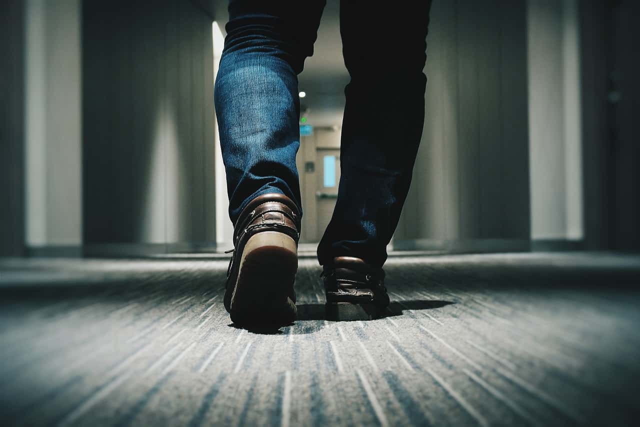 Man walking on dark floor