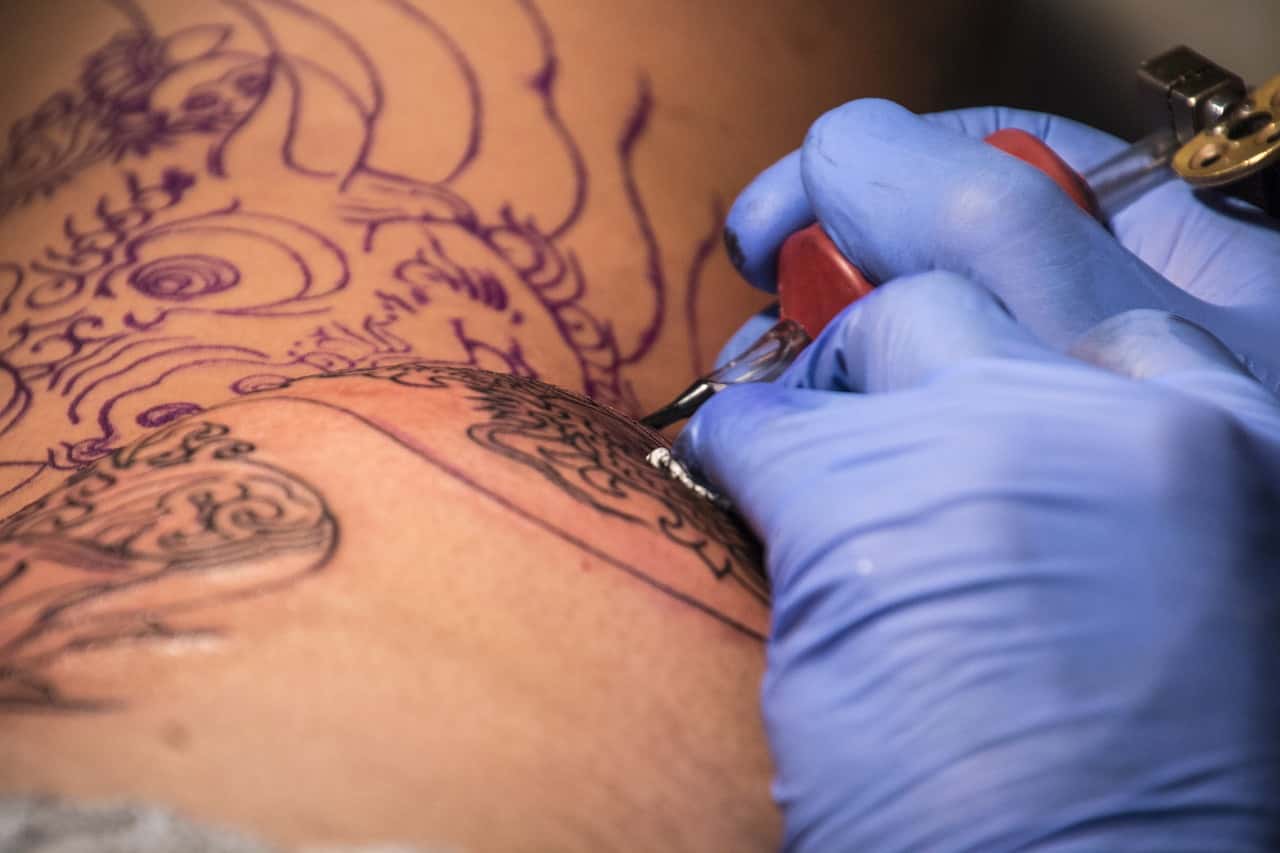 Tattoo designer making tattoo
