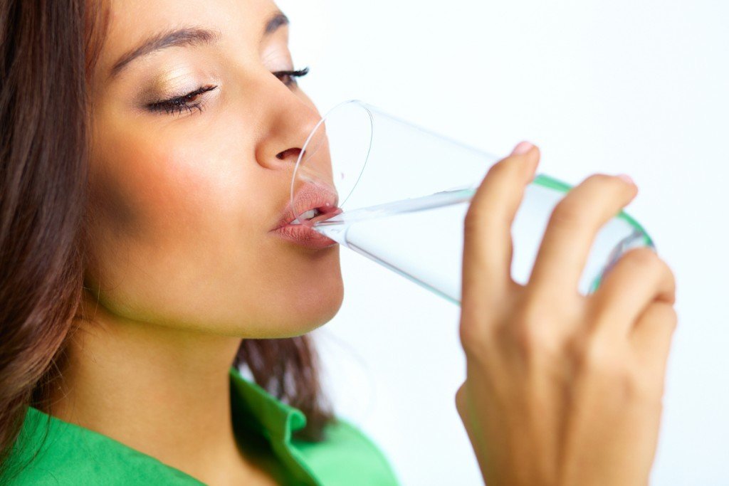 Woman drinking glass of water