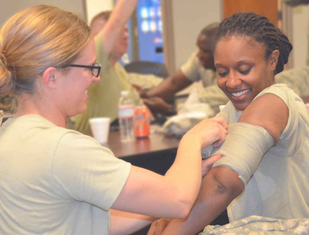 Nurse dressing up a wound