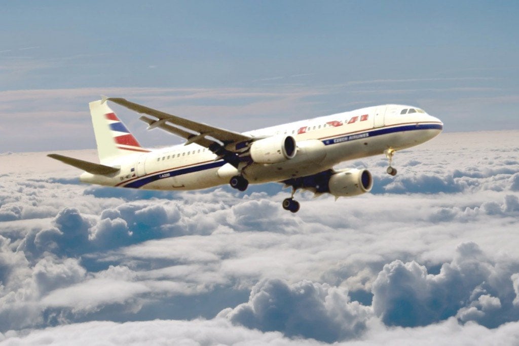 Airplane flying above clouds