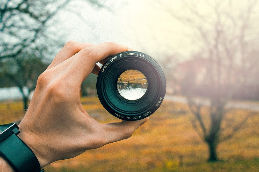 Camera lens inverted image in glass The inverted image of a refracting telescope