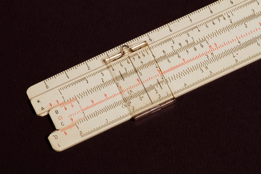 Logarithmic ruler on a wooden table(Saim Tokacoglu)S