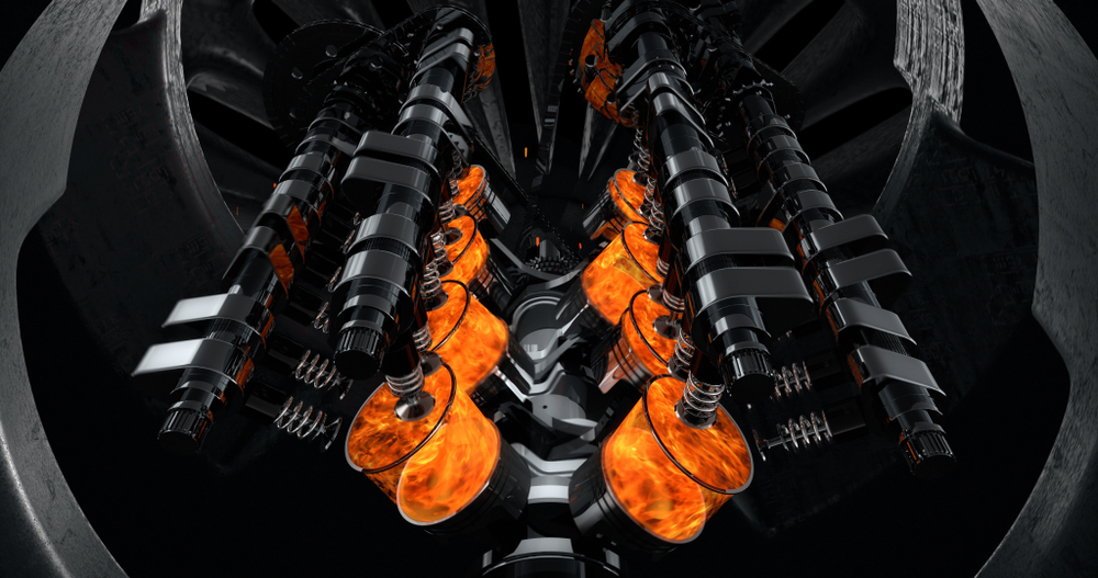 CG model of a working V8 engine with explosions and sparks inside of another machine. Pistons and other mechanical parts are in motion. - Illustration(yucelyilmaz)s