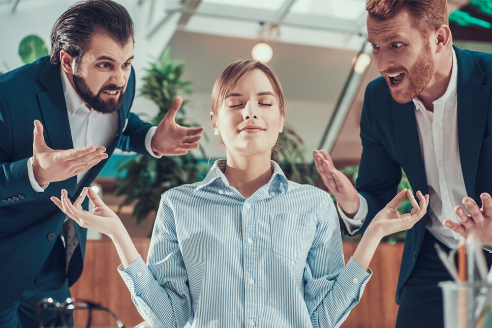 People shout at meditating worker in suit in office. Stay Calm. - Image(VGstockstudio)s