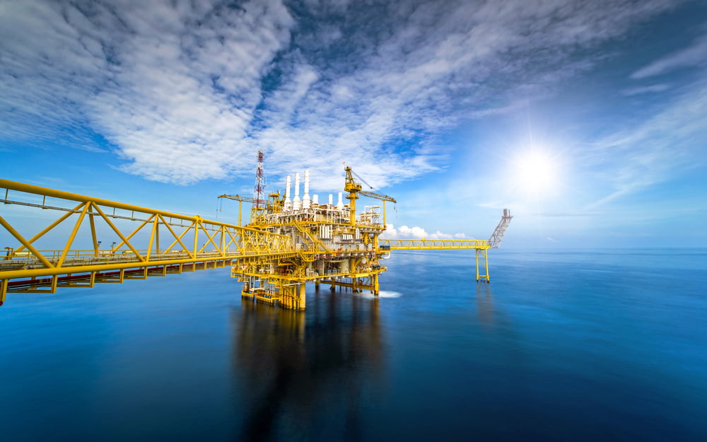 Large Offshore oil rig drilling platform at sunset and beautiful sky in the gulf of Thailand - Image(Red ivory)s