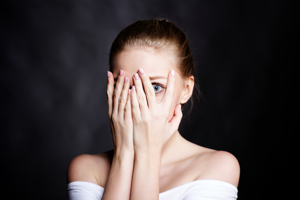 Young girl covered her face with fear - Image(Ipatov)s