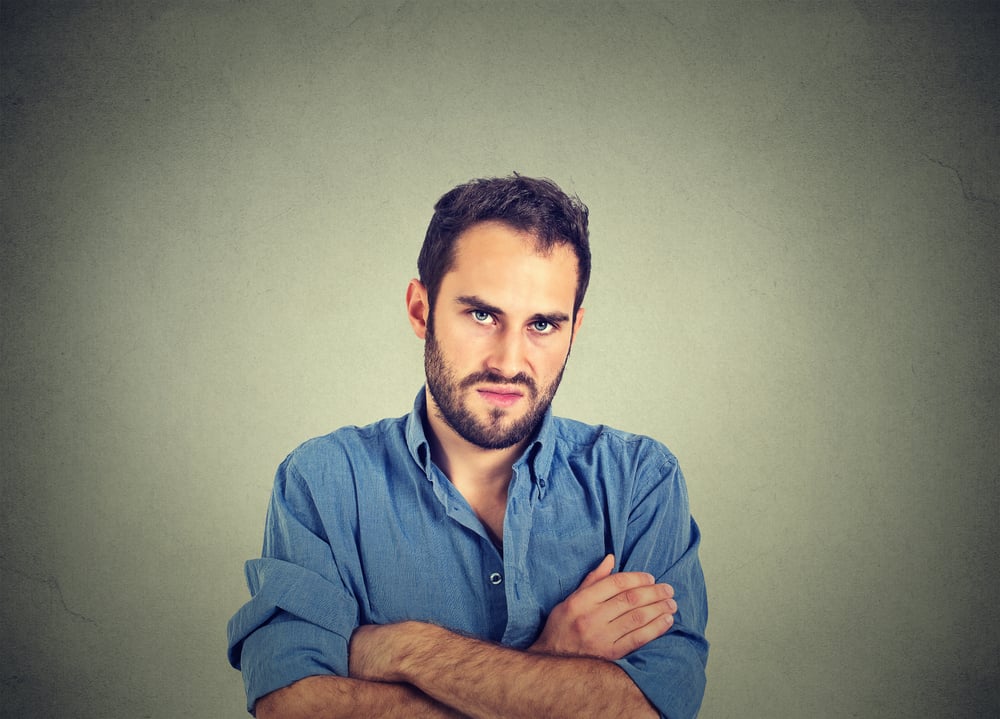 Closeup portrait of angry young man, about to have nervous breakdown, isolated on gray wall background(pathdoc)s