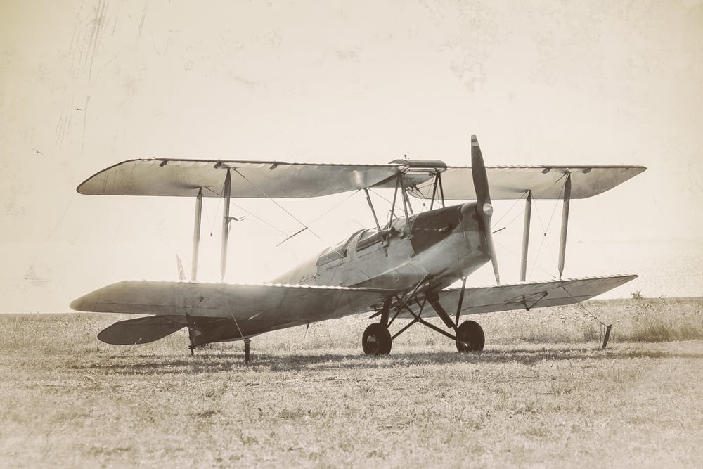 Old airplane at the airfield. Air travel with biplane - concept of retro aviation. Retro image of old aircraft.( Repina Valeriya)s