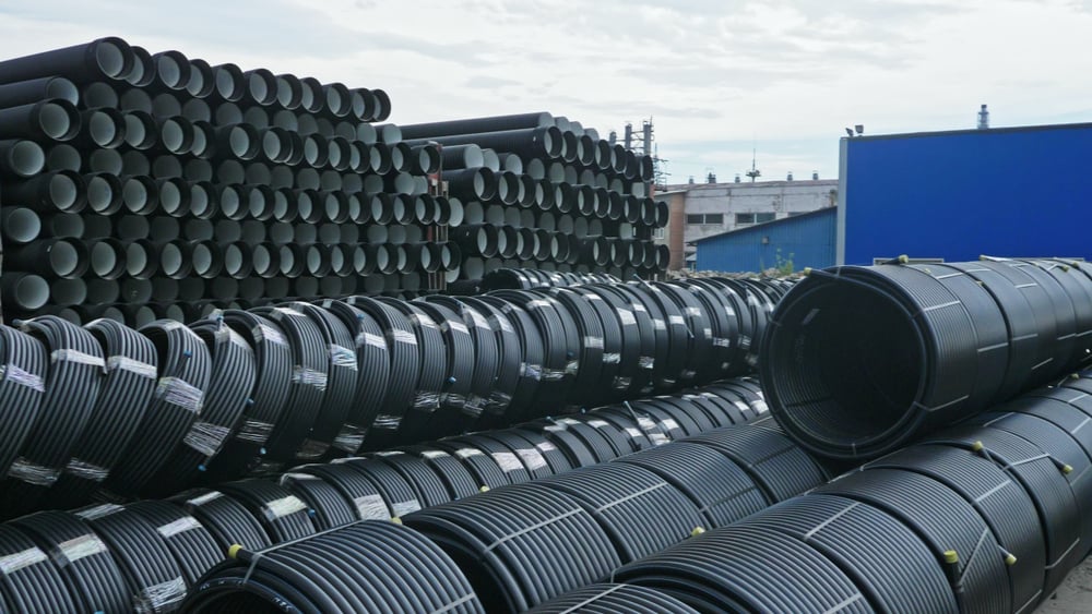 Warehouse of finished plastic pipes industrial outdoors storage site. Manufacture of plastic water pipes factory(ivandan)S