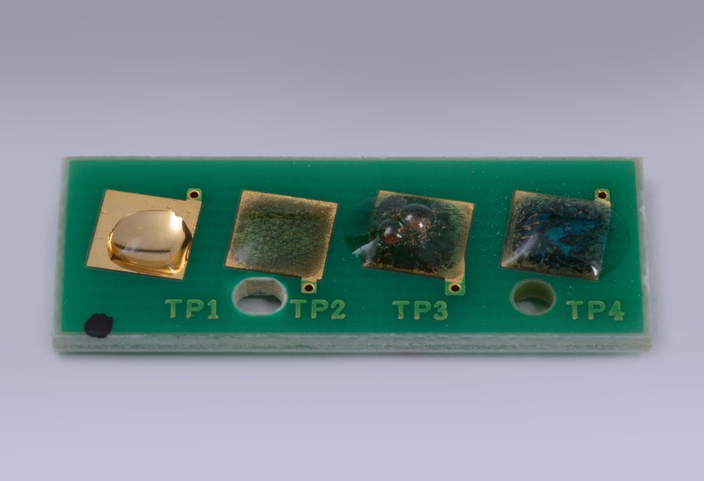 aqua regia at different concentrations react with gold plated contacts on a printed circuit board(Lakeview Images)S