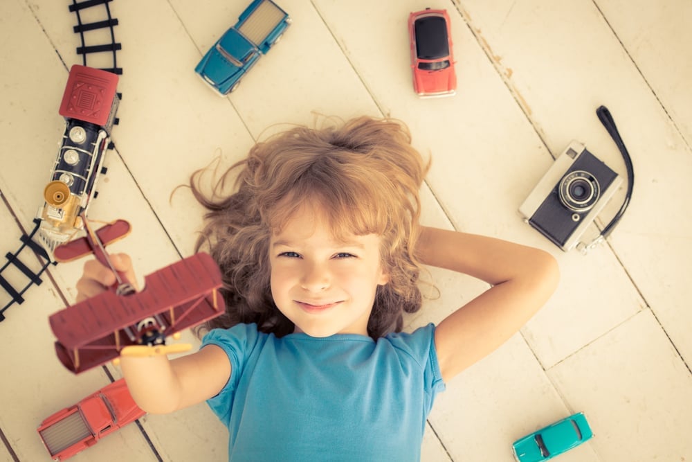 Child playing with vintage toys at home(Sunny studio)S