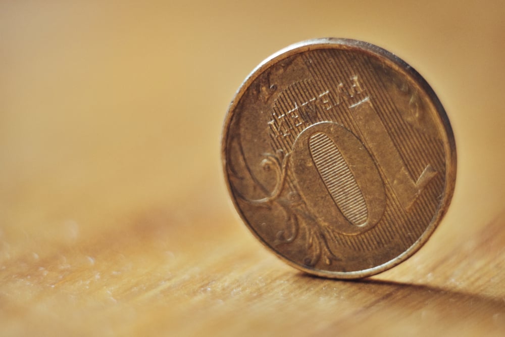 a ten-ruble coin stands on the edge( Alexander Sobol)s