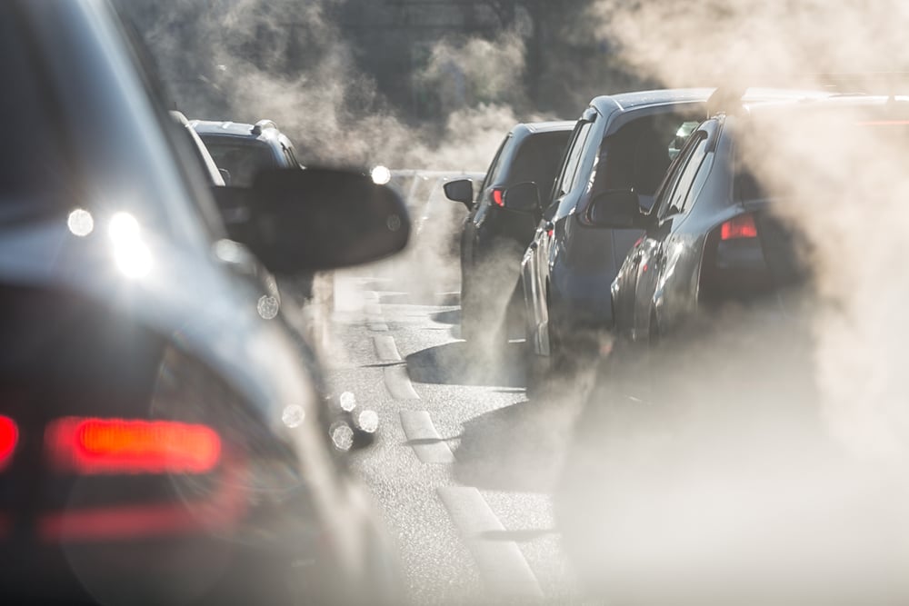 Blurred silhouettes of cars surrounded by steam from the exhaust pipes(LanaElcova)s