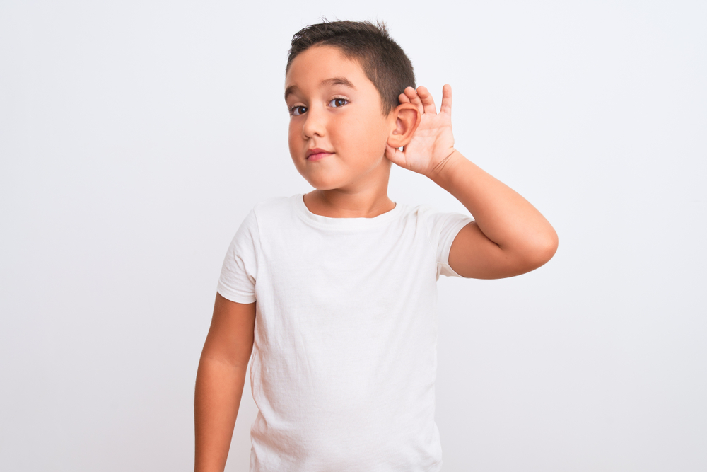 Beautiful kid boy wearing casual t-shirt standing over isolated white background(Krakenimages.com)s