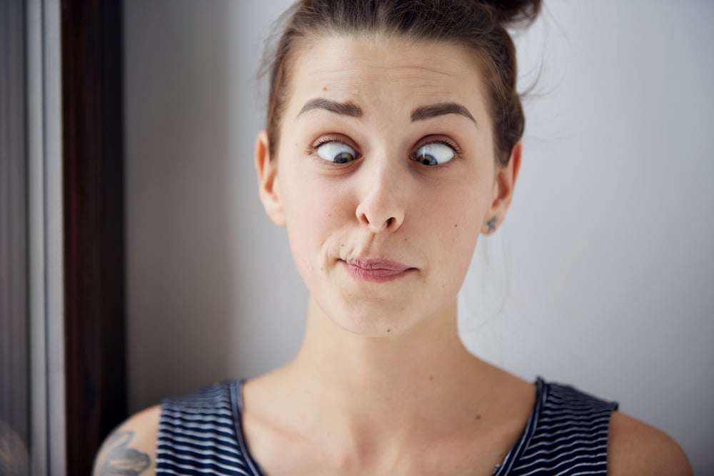 Young brunette woman looking cross-eyed(WAYHOME studio)s