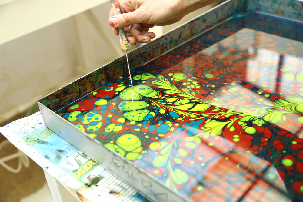 Ebru is a Turkish traditional painting method to transfer paint from a special fluid onto paper(Zinemo)s
