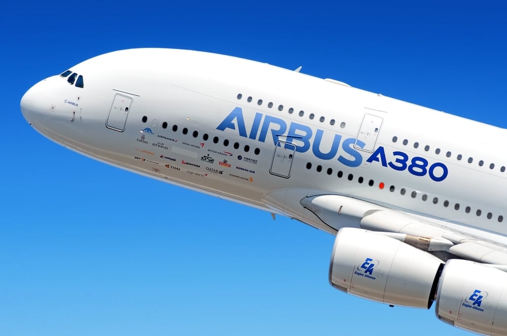 Airbus Industries EADS Airbus A380 super jumbo large wide body passenger airplane flying detail aerial exterior close up crop view(vaalaa)s