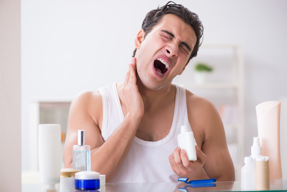 Young handsome man shaving early in the morning at home(Elnur)s