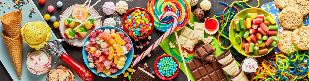 An assortment of colourful, festive sweets, ice-cream and candy in a panoramic orientation(stockcreations)s
