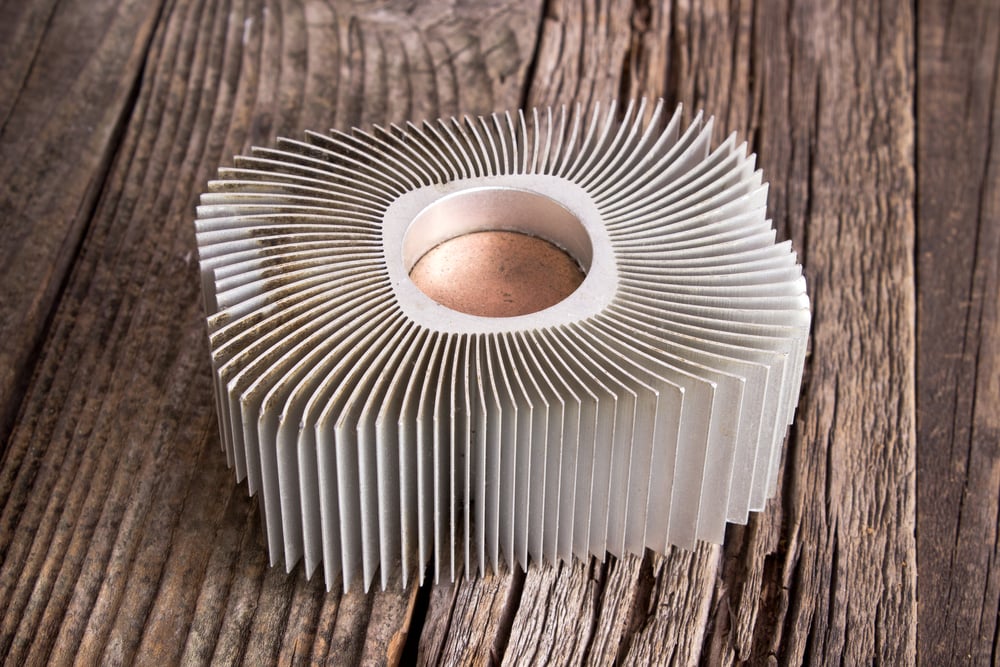 Aluminum cpu cooler heat sink on wooden background(Gavran333)S