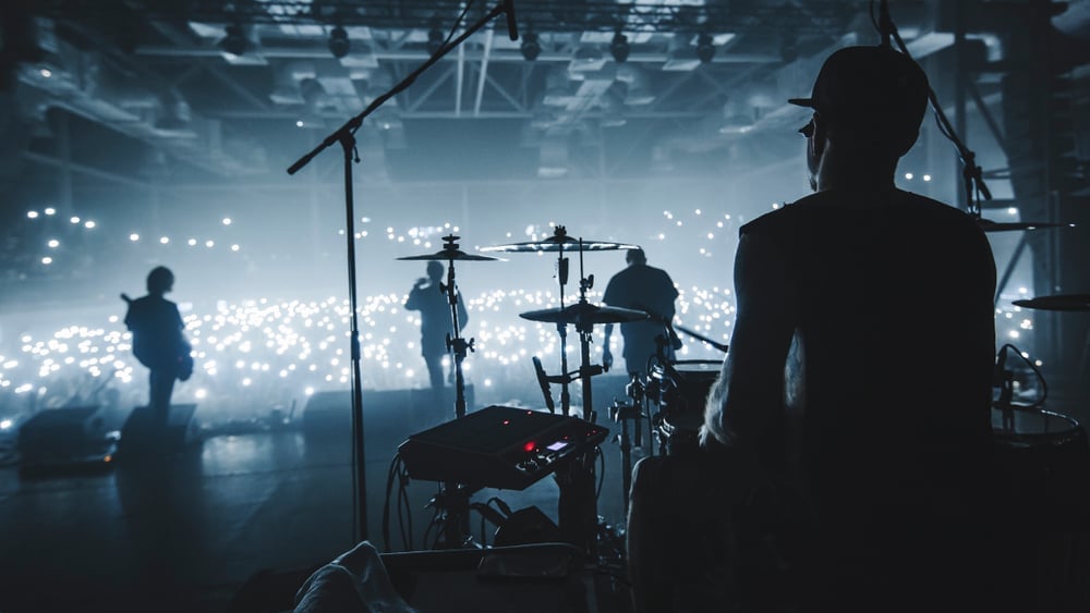 Music band group silhouette perform on a concert stage(Taya Ovod)s