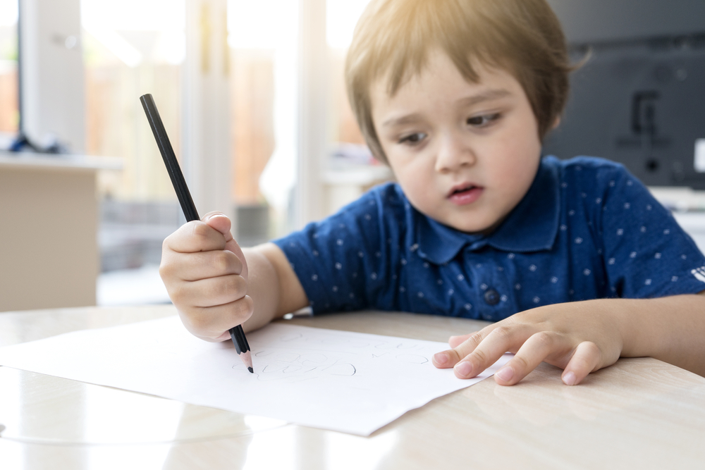 Selective,Focus,Of,Little,Boy,Hands,Learning,How,To,Write