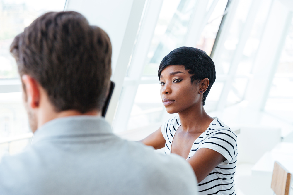 Two young businesspeople having meeting