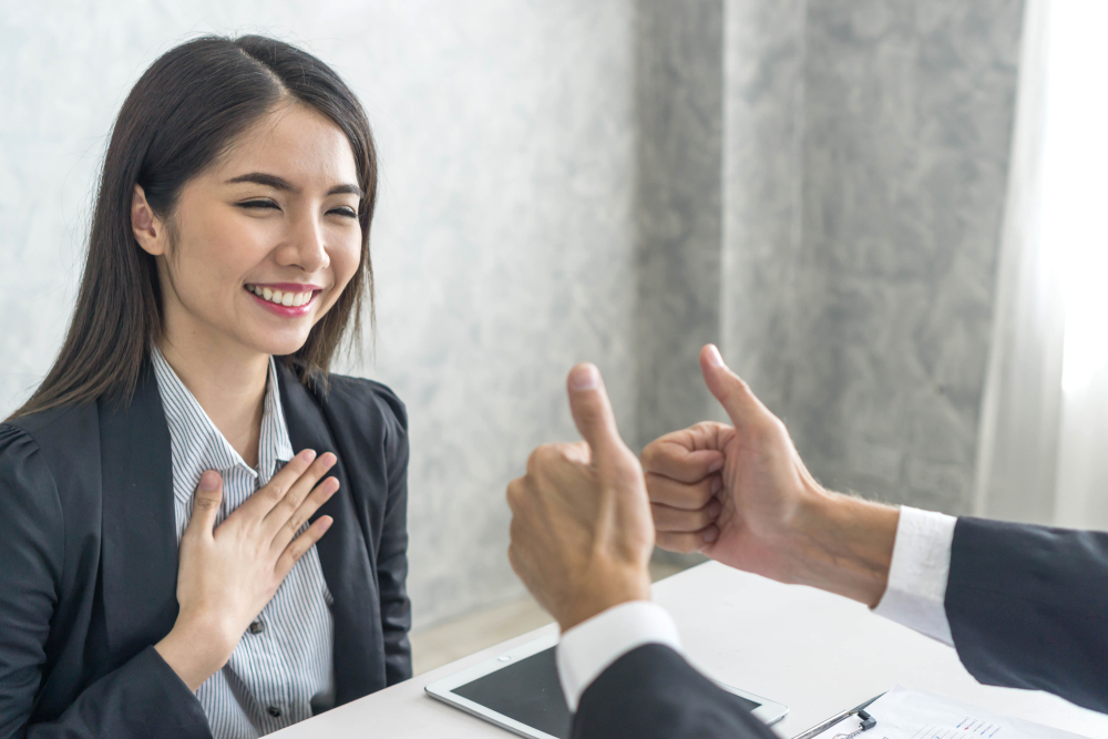 Asian,Business,Woman,Employee,With,Smiling,Face,For,Her,Success