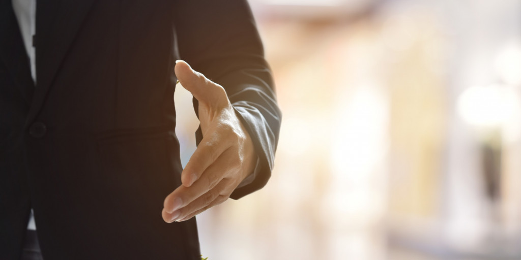 woman-business-suit-ready-hand-shake