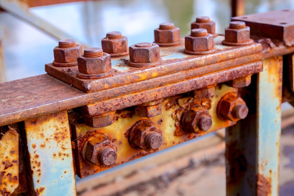 Detail,Of,Steel,Construction,With,Old,Rusty,Screws,On,The